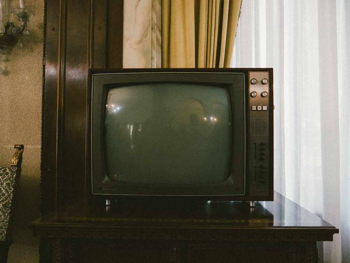 An old CRT television on a table