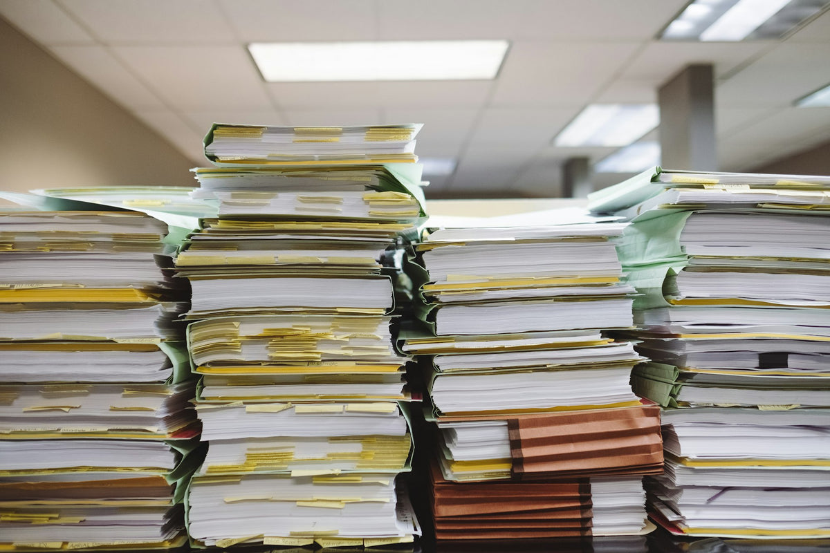 Stacks of paper and file folders