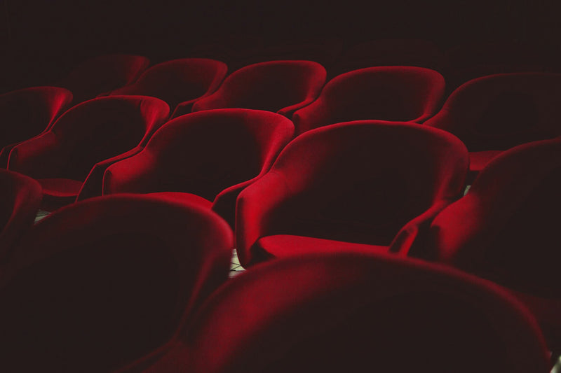 Rows of red movie theater seats